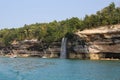 Spray falls, colorful sandstone cliffs and formations at Pictured Rocks National Lakeshore of Lake Superior, Munising, Michigan Royalty Free Stock Photo