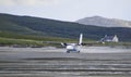 Spray Flying from a Plane Landing at the Barra Airport