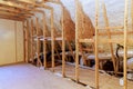 Spray foam thermal hydro insulation is used as a wall insulation in new home that is under construction Royalty Free Stock Photo