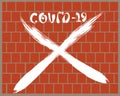 Spray graffiti inscription COVID-19 on red brick wall. New official name for Coronavirus. A warning message against spreading Royalty Free Stock Photo