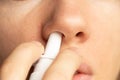 Spray for a nose in a girl`s nose, nose drops, gri n and colds, cannot breathe, nasal congestion