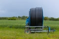 Spray nozzle irrigation system - rolled water pipe on a spool - France