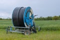 Spray nozzle irrigation system - rolled water pipe on a spool - France