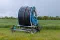 Spray nozzle irrigation system - rolled water pipe on a spool - France