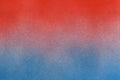 spray paint gradient from red to blue on a white paper background