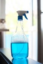 spray for washing windows on the background of the balcony Royalty Free Stock Photo