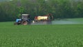Sprayer on green wheat field contributes crop protection products