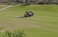 Sprayer machine performing maintenance at golf course