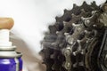 Spraying lubricant on bicycle rear gears, soft focus Royalty Free Stock Photo