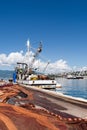 Spread fishing nets, fishing boat on dock Royalty Free Stock Photo