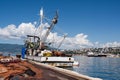 Spread fishing nets, fishing boat on dock Royalty Free Stock Photo