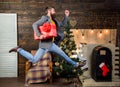 Spread happiness and joy. Bearded guy in motion jump. Delivery christmas present. Gifts delivery. Still have time