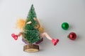 Christmas tree on doll and decoration balls holiday sex minimal creative concept