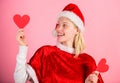 Spread love around. Girl in love happy wear santa costume celebrate christmas pink background. Merry christmas and happy