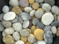 Spread and mixed beach pebbles in soft light