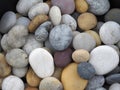 Spread and mixed beach pebbles in soft light