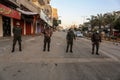 A The spread of Palestinian security personnel in an empty street during a complete closure amid the ongoing COVID-19 coronavirus