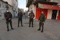 A The spread of Palestinian security personnel in an empty street during a complete closure amid the ongoing COVID-19 coronavirus