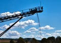 Spreader in an open pit gravel pit that dumps sand and gravel via a conveyor belt