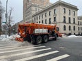 Spreader truck spreading salt on the highway in New York, USA