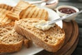 Spreading cream cheese on toasted bread, closeup Royalty Free Stock Photo