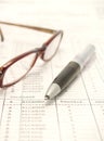 Spreadsheet, pen and eyeglasses Royalty Free Stock Photo