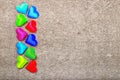 Sprectrum multi-colored hearts on a gray background