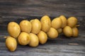 Sprig of ripe yellow dates close-up on a wooden board