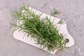 Sprigs of rosemary on a wooden board. Flat lei.