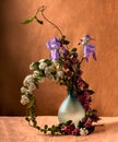Sprimg flowers bouquet inside transparent turquoise vase