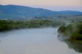 a band of fog over the river Royalty Free Stock Photo