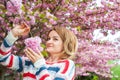 Spring allergy. Beautiful woman enjoying nature blooming tree. Royalty Free Stock Photo