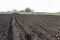 Spring arable land on a farm with black soil, Royalty Free Stock Photo