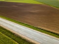 Spring arable land. A field and road. View from above. Royalty Free Stock Photo