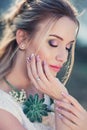 Attractive woman outdoors beauty portrait. Romantic girl with beautiful nails Royalty Free Stock Photo