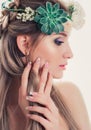 Attractive woman outdoors beauty portrait. Romantic girl with beautiful nails and flowers Royalty Free Stock Photo