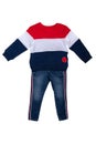 Spring and autumn children clothes. A blue jeans and a red white blue striped cozy warm sweater or pullover isolated on a white Royalty Free Stock Photo