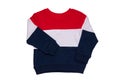 Spring and autumn children clothes. A red white blue striped cozy warm sweater or pullover isolated on a white background. Winter Royalty Free Stock Photo