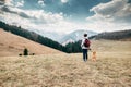 Spring, autumn turistic time - woman with beagle dog on mountain Royalty Free Stock Photo