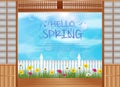 Spring background behind the opened doors with wooden fence and daisies flowers Royalty Free Stock Photo