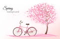 Spring background with a blossoming tree and a bike.