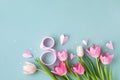 Spring background with bouquet of pink tulip flowers on pastel blue table. Greeting card for 8 March International Women Day. Royalty Free Stock Photo