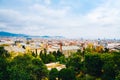 Spring Barcelona general view on a cloudy day from mountain Montjuic. Clouds, beautiful landscape, urban streets, roofs, blooming Royalty Free Stock Photo