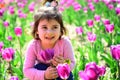 Spring beauty. Little girl in sunny spring. Summer girl fashion. Happy childhood. face skincare. allergy to flowers Royalty Free Stock Photo