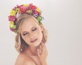 Spring beauty. A young woman posing with her eyes shut and flowers in her hair. Royalty Free Stock Photo