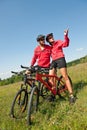 Spring bike - Young sportive couple in meadow Royalty Free Stock Photo