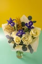 Spring bouquet of flowers. Irises, tulips, mimosa and eucalyptus. Yellow and blue flower. Bud close-up. Floral Royalty Free Stock Photo