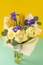 Spring bouquet of flowers. Irises, tulips, mimosa and eucalyptus. Yellow and blue flower. Bud close-up. Floral Royalty Free Stock Photo