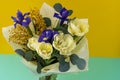 Spring bouquet of flowers. Irises, tulips, mimosa and eucalyptus. Yellow and blue flower. Bud close-up. Floral Royalty Free Stock Photo