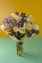 Spring bouquet of flowers. Irises, tulips, mimosa and eucalyptus. Yellow and blue flower. Bud close-up. Floral Royalty Free Stock Photo